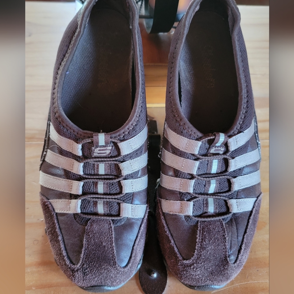 Brown Skechers slip ons